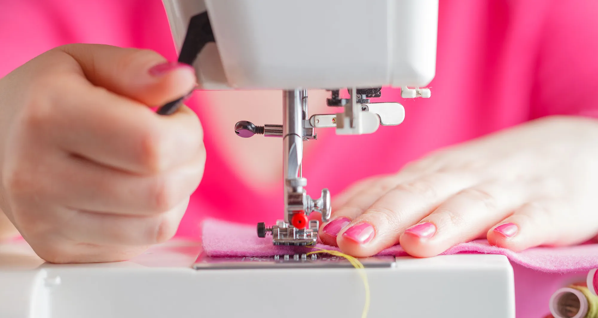 A garment being stitched on a sewing machine